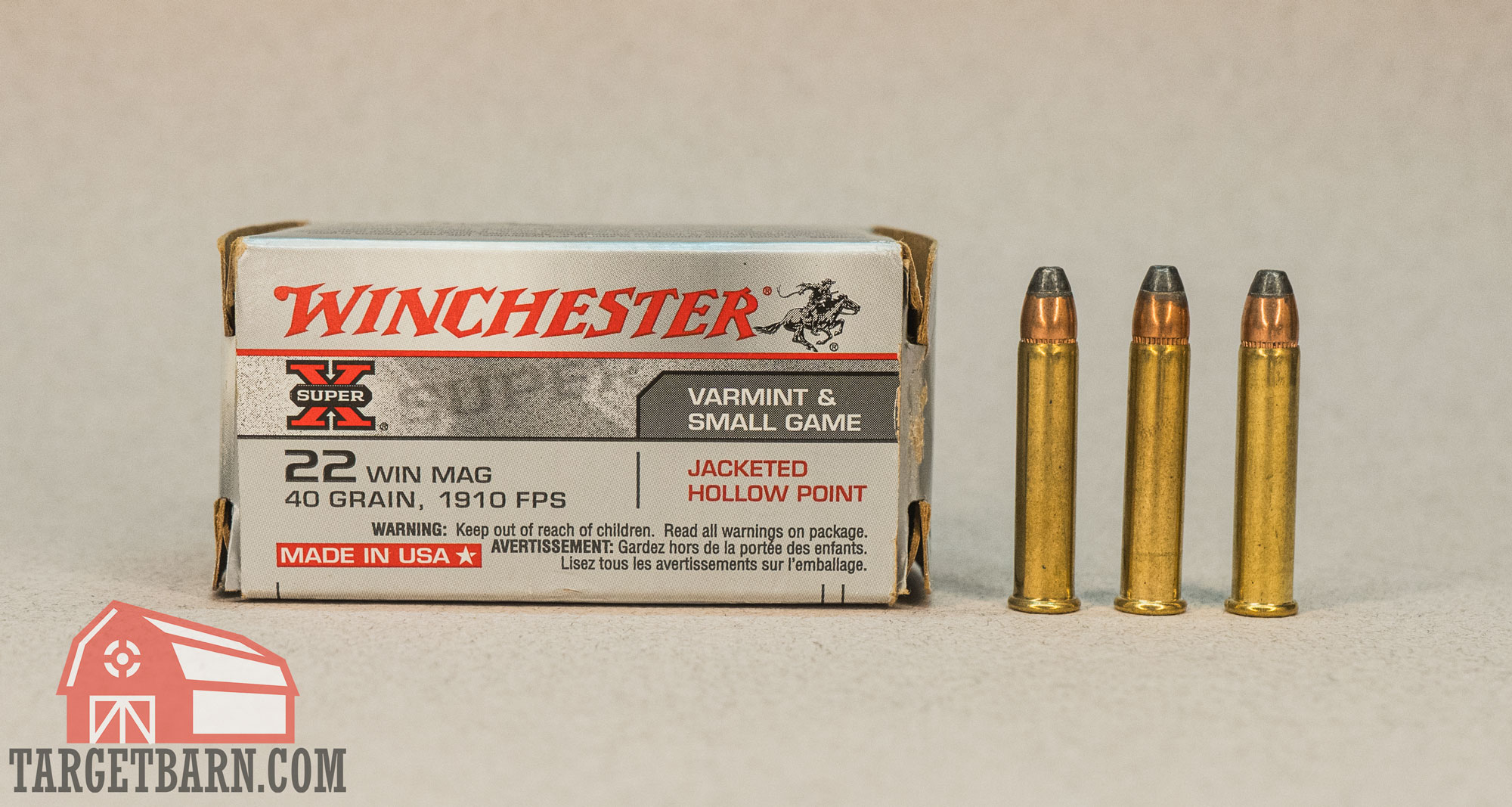 22 wmr ammo a box and three rounds of winchester 22 wmr ammo