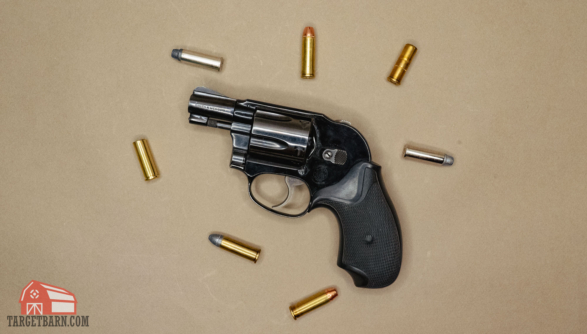 a 38 revolver surrounded by different types of 38 special ammo