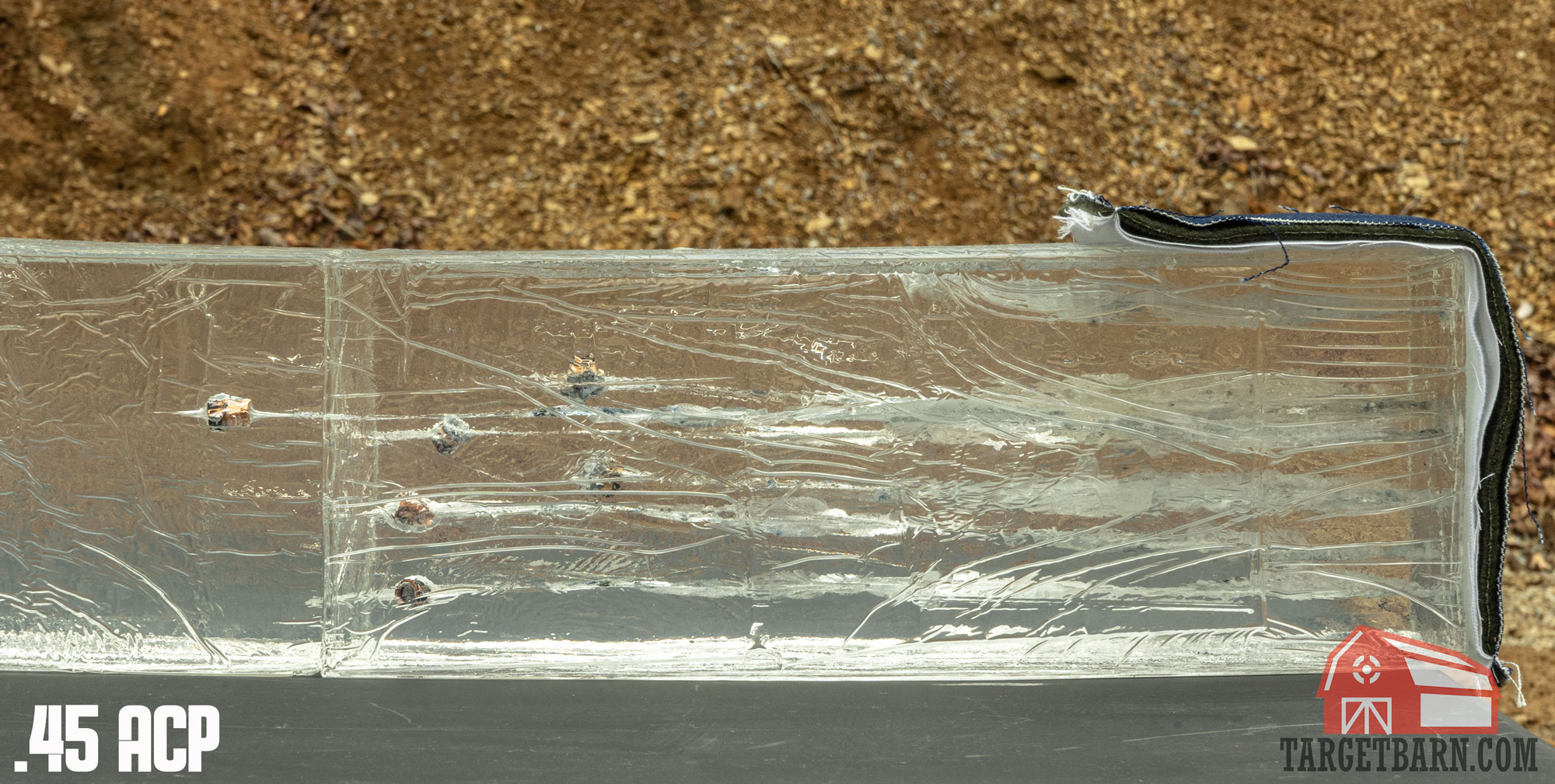 six .45 acp rounds in ballistic gel with a 4-layer fabric covering