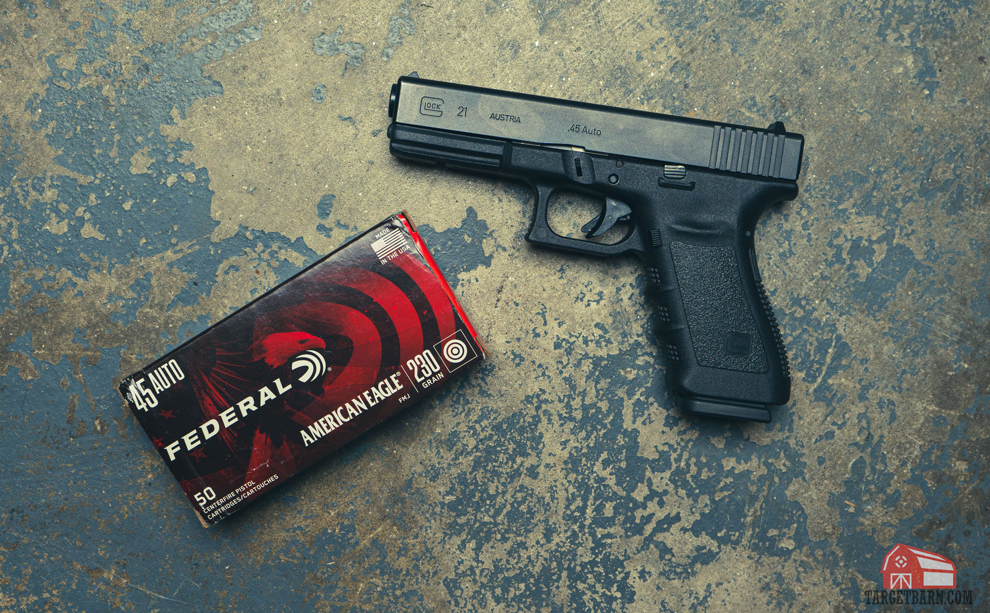 a .45ACP glock 21 pistol next to a box of federal american eagle 45ACP ammo