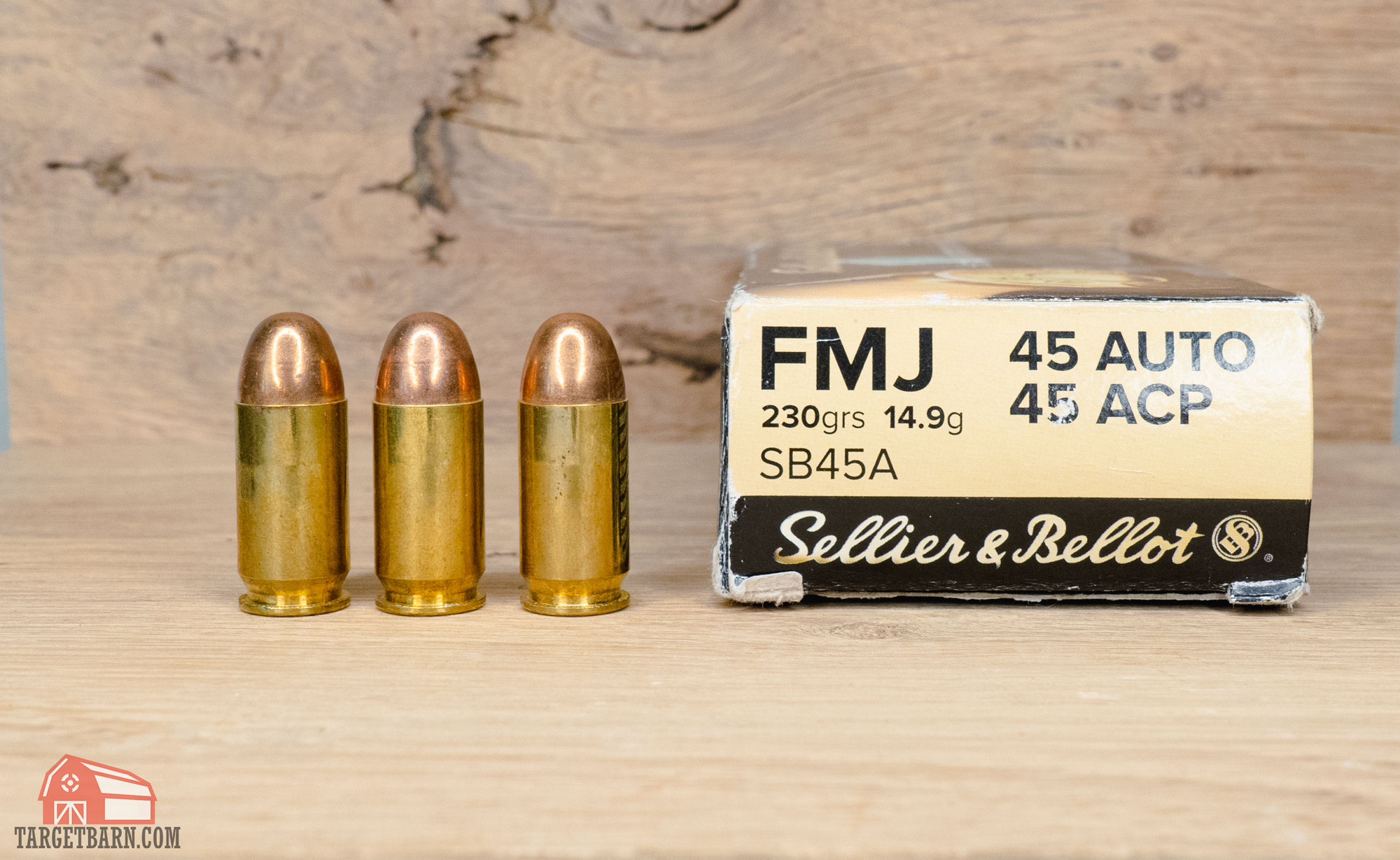 three rounds of .45acp ammo and a box that says "45 auto" and ".45 ACP"