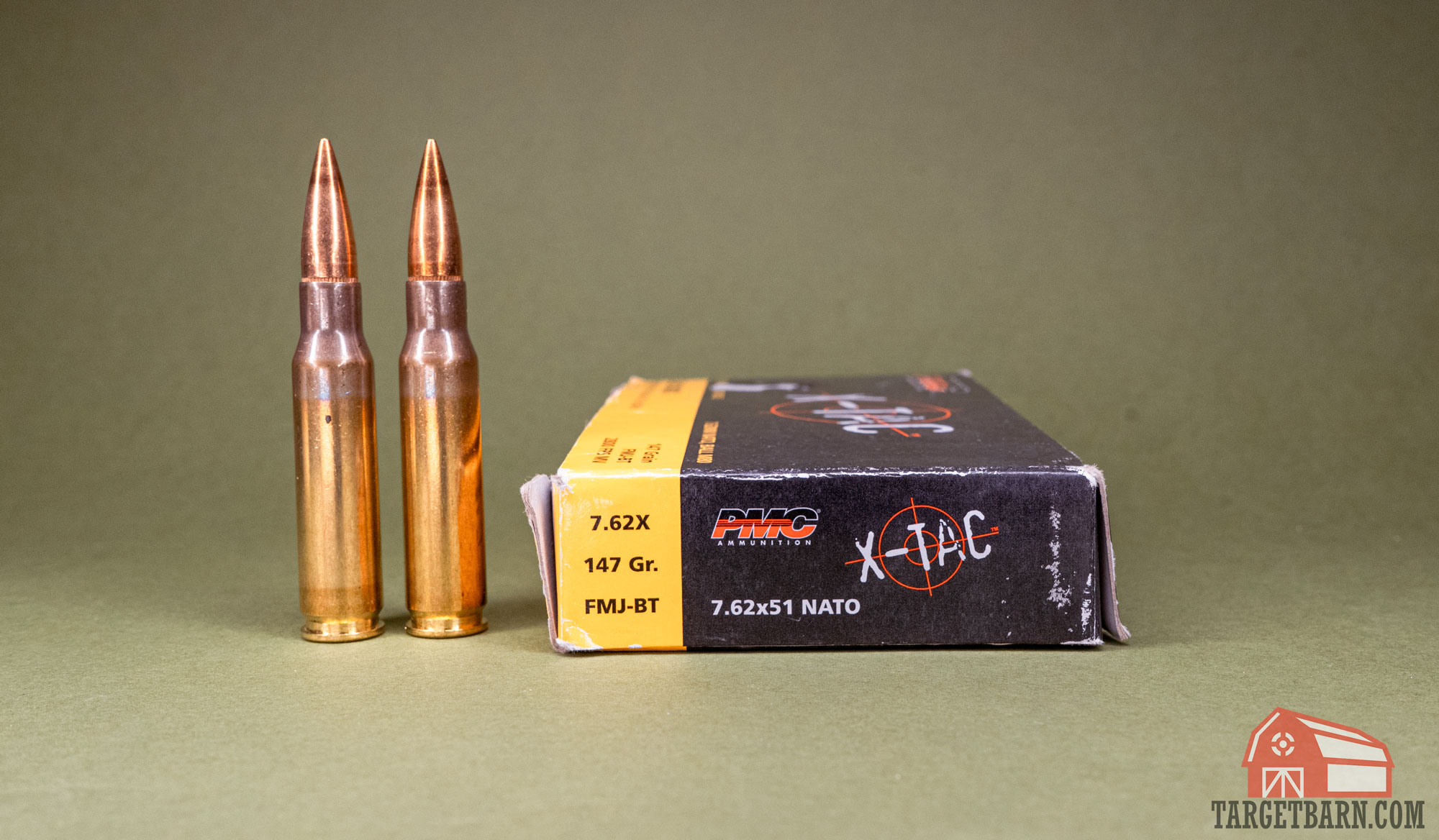 a box of x-tac 7.62 nato and two rounds of 7.62