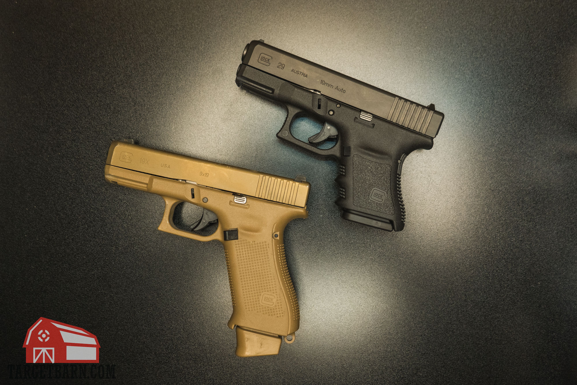 10mm vs. 9mm pistols comparing 10mm vs. 9mm pistols with the glock 19x and glock 29 laying next to each other