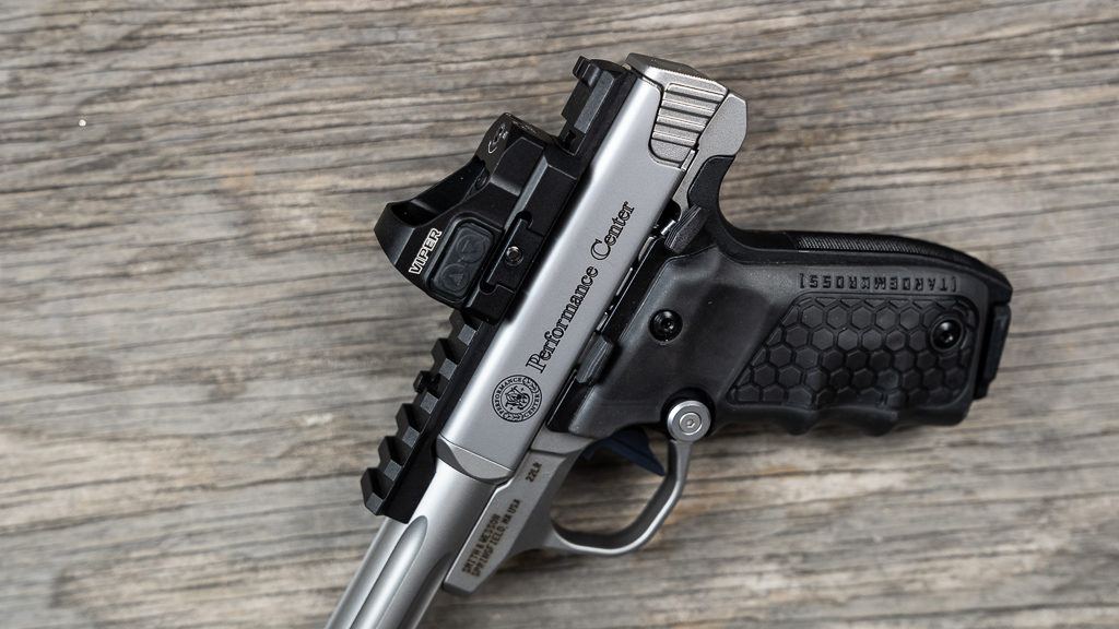 rimfire pistol with a red dot optic mounted on a Picatinny rail 