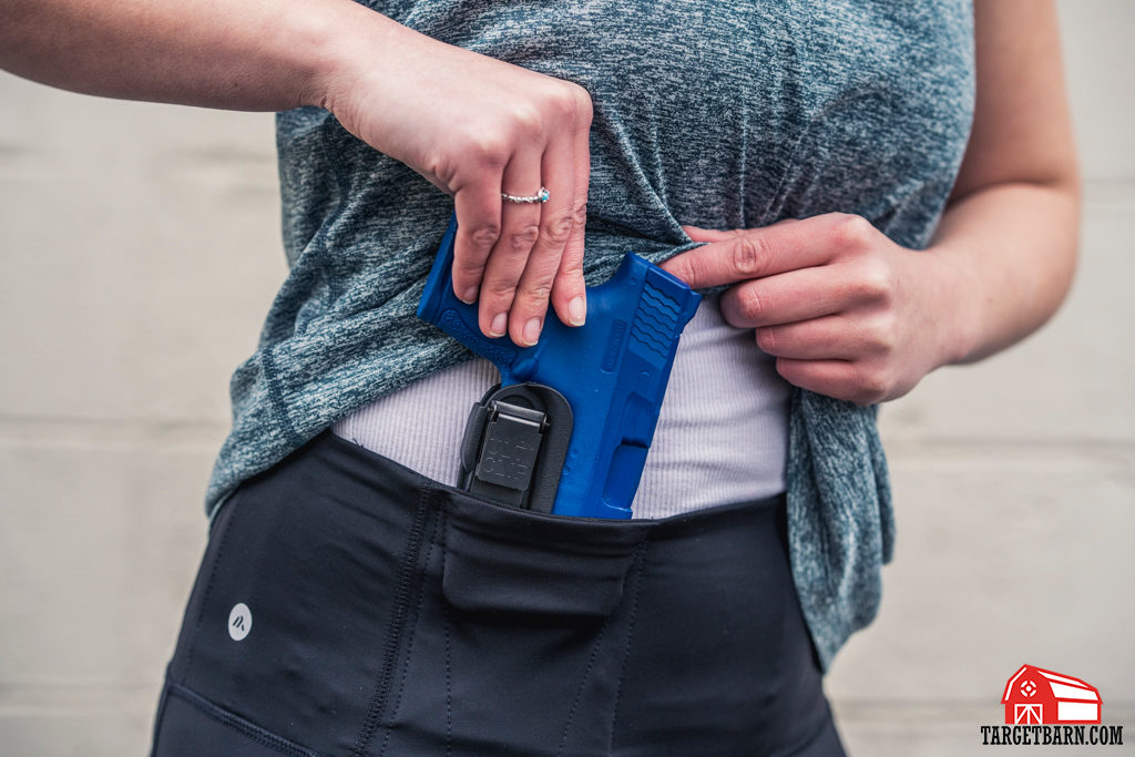 Alexo Athletica The Signature Pant concealed carry leggings paired with a holster for added trigger protection