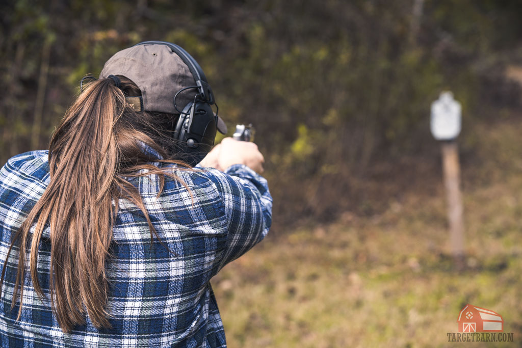 woman shooting a double action revolver