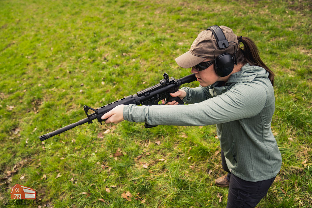 girl shooting an ar-15 on a range
