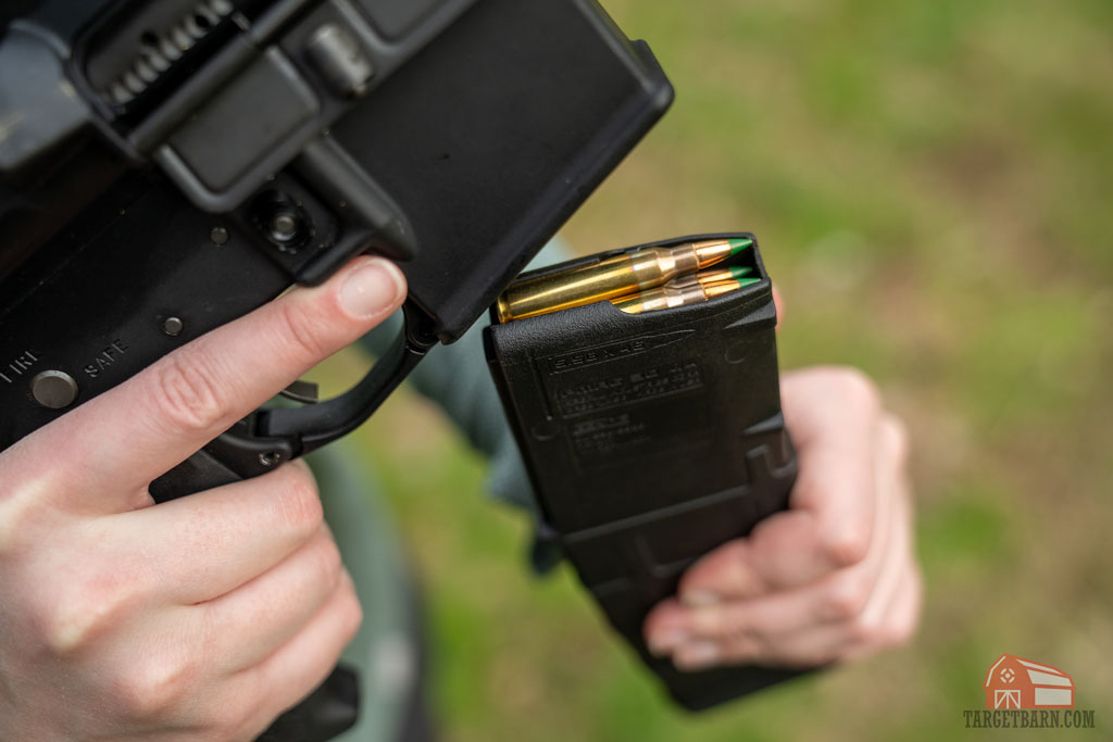 an ar-15 magazine loaded with green tip m855 ammo