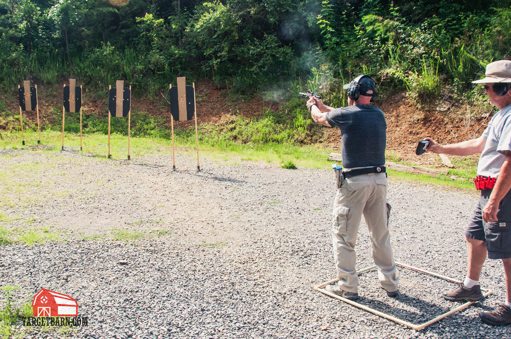 an open shooter shooting a uspsa classifier with his race gun