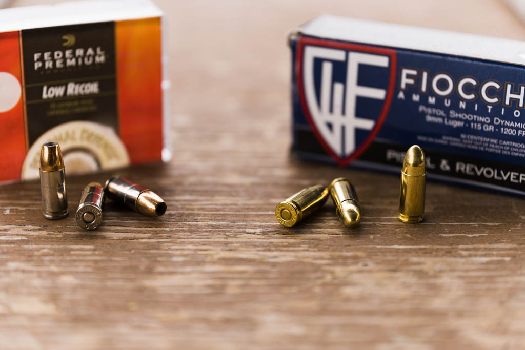 Federal Premium JHP box and rounds next to Fiocchi FMJ box and rounds