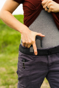 the author drawing her concealed carry gun loaded with JHP ammo