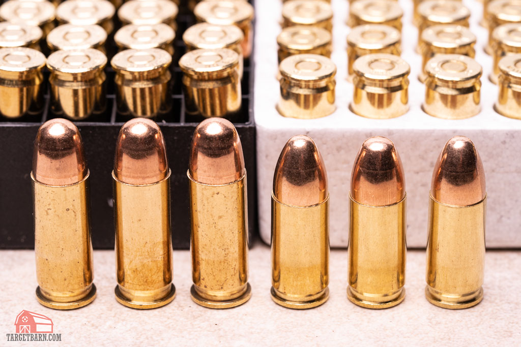.38 super cartridge next to 9mm cartridge