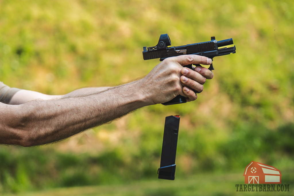Dropping a magazine from a pistol while shooting The Fast Drill