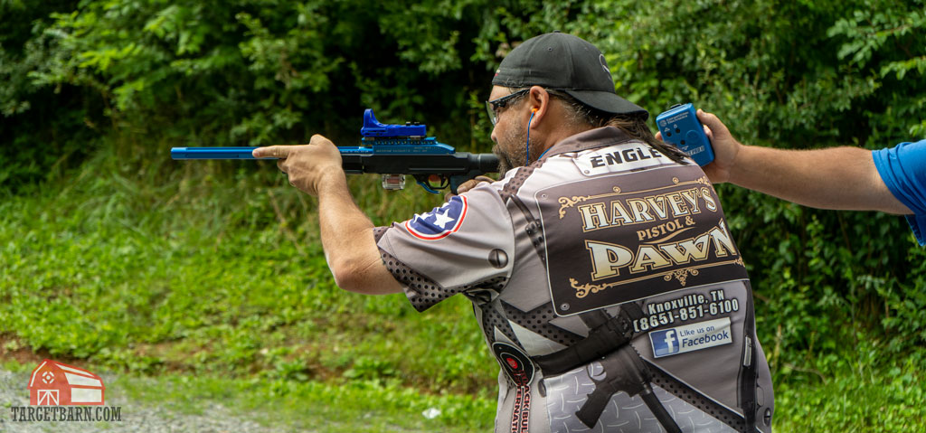 a competitor shooting in rimfire rifle open steel challenge division