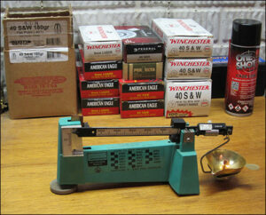 a scale measuring the weight of a bullet to calculate power factor