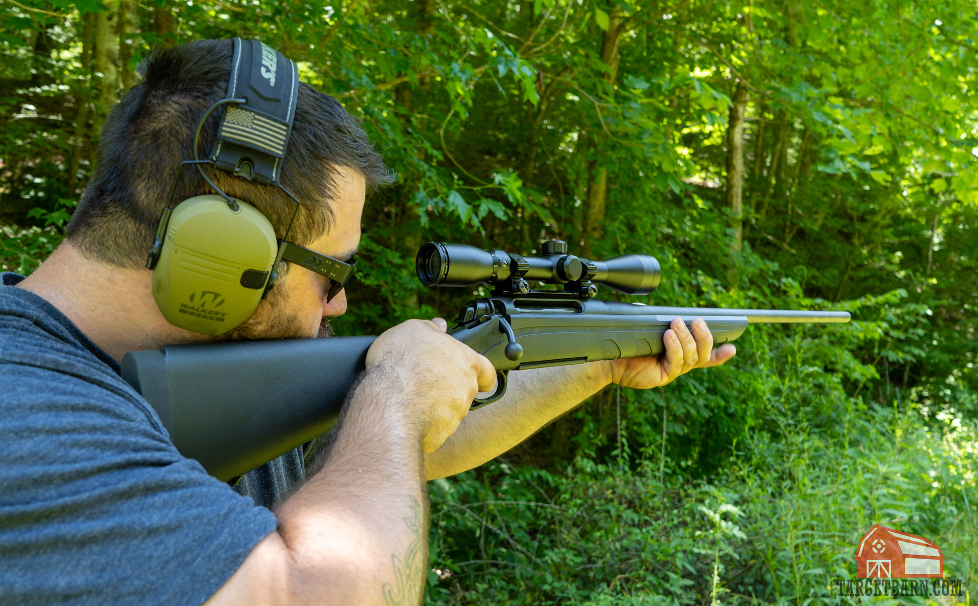 a man shooting a remington bolt-action rifle at the range