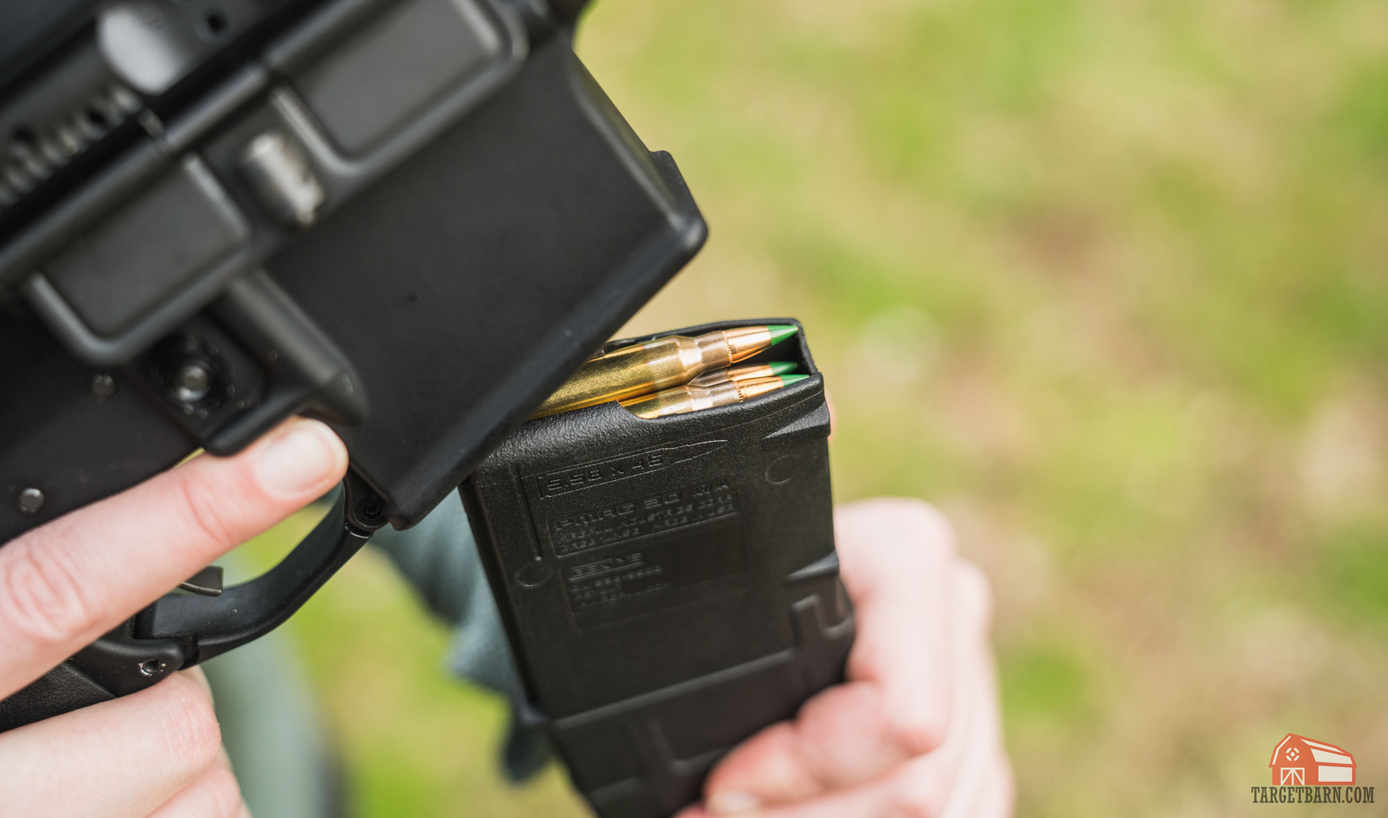 brass cased 223 in a magazine being loaded into an ar-15