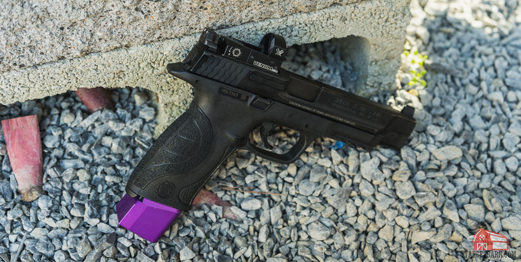 a smith and wesson with vortex red dot and magazine extender for carry optics steel challenge division