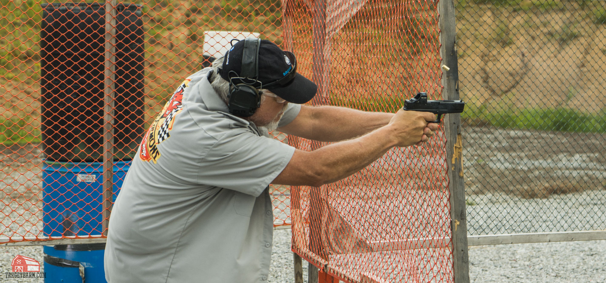 an idpa shooter shooting in carry optics division