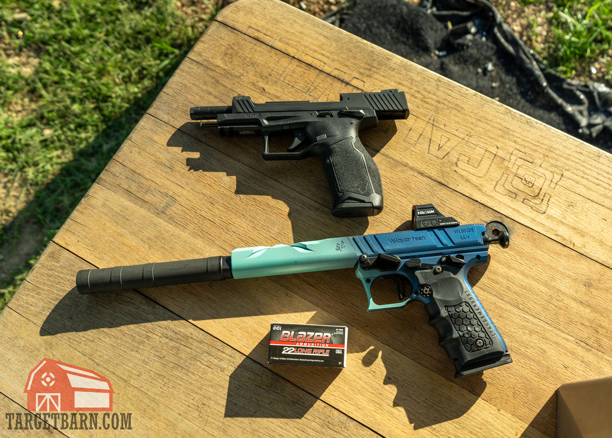 cci blazer 22 pistols a taurustx 22 and volquartsen mamba pistol with a box of blazer .22lr at the range