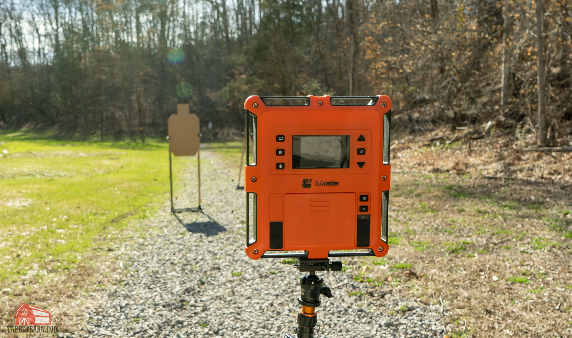 a chronograph at the range in front of a cardboard target