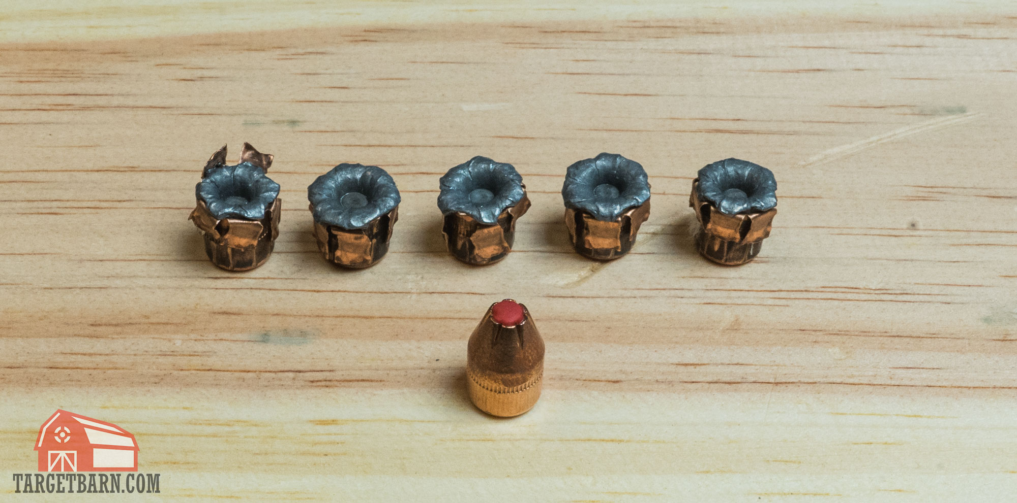 5 expanded hornady critical defense .38 special +p 110gr ftx rounds after being fired in gel and an unfired ftx bullet