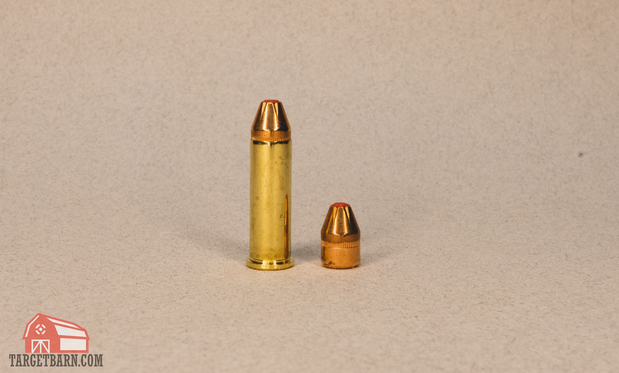 a full critical defense .38 special +p 110gr ftx round next to just the ftx bullet