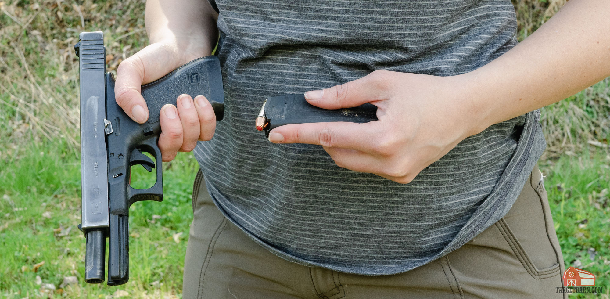 a shooter loading 45acp into a glock 21c at the range