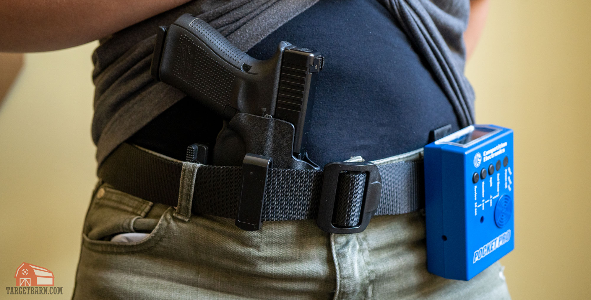 a holstered gun and shot timer for dry fire training