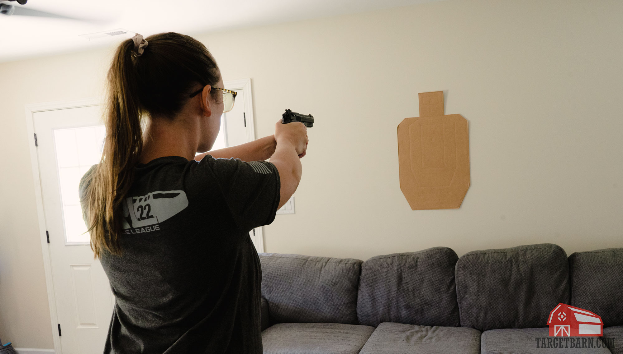 the author dry firing at a uspsa target