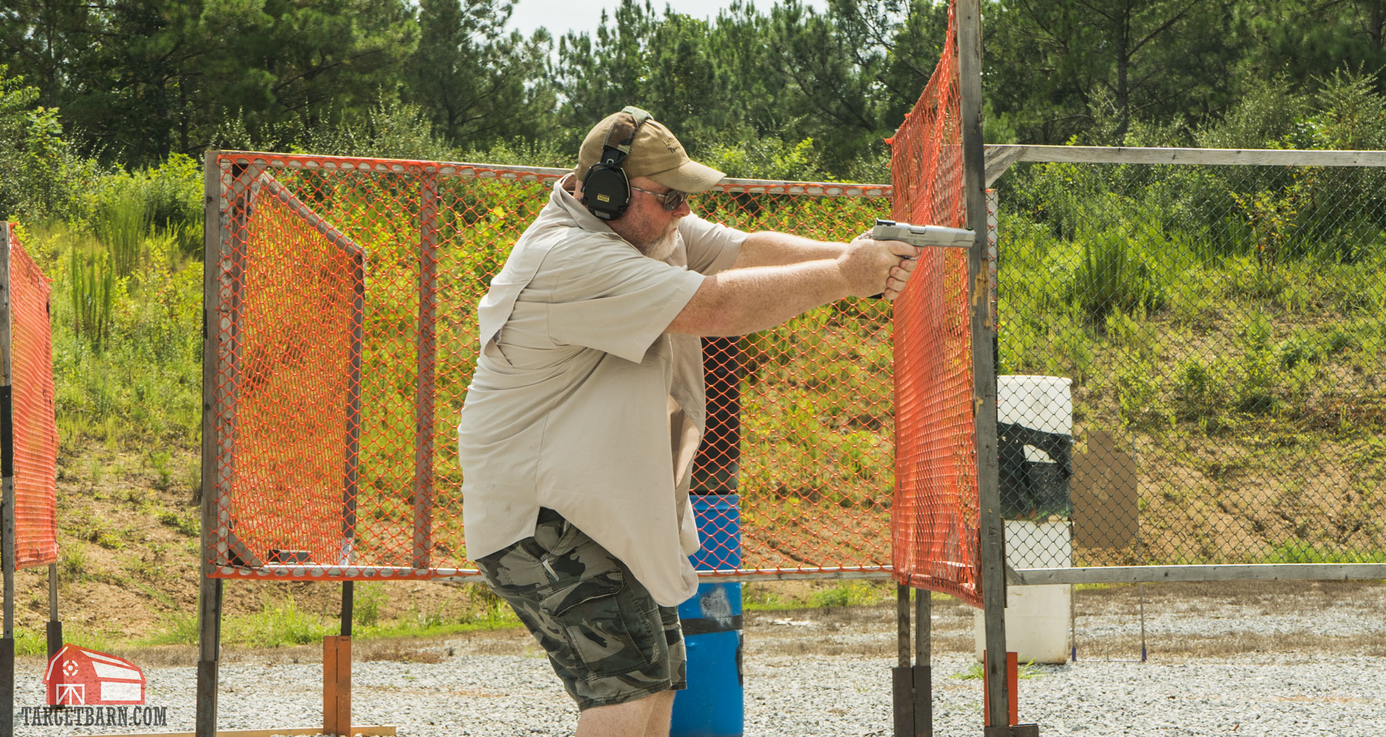 an idpa shooter shooting in the enhanced service pistol division