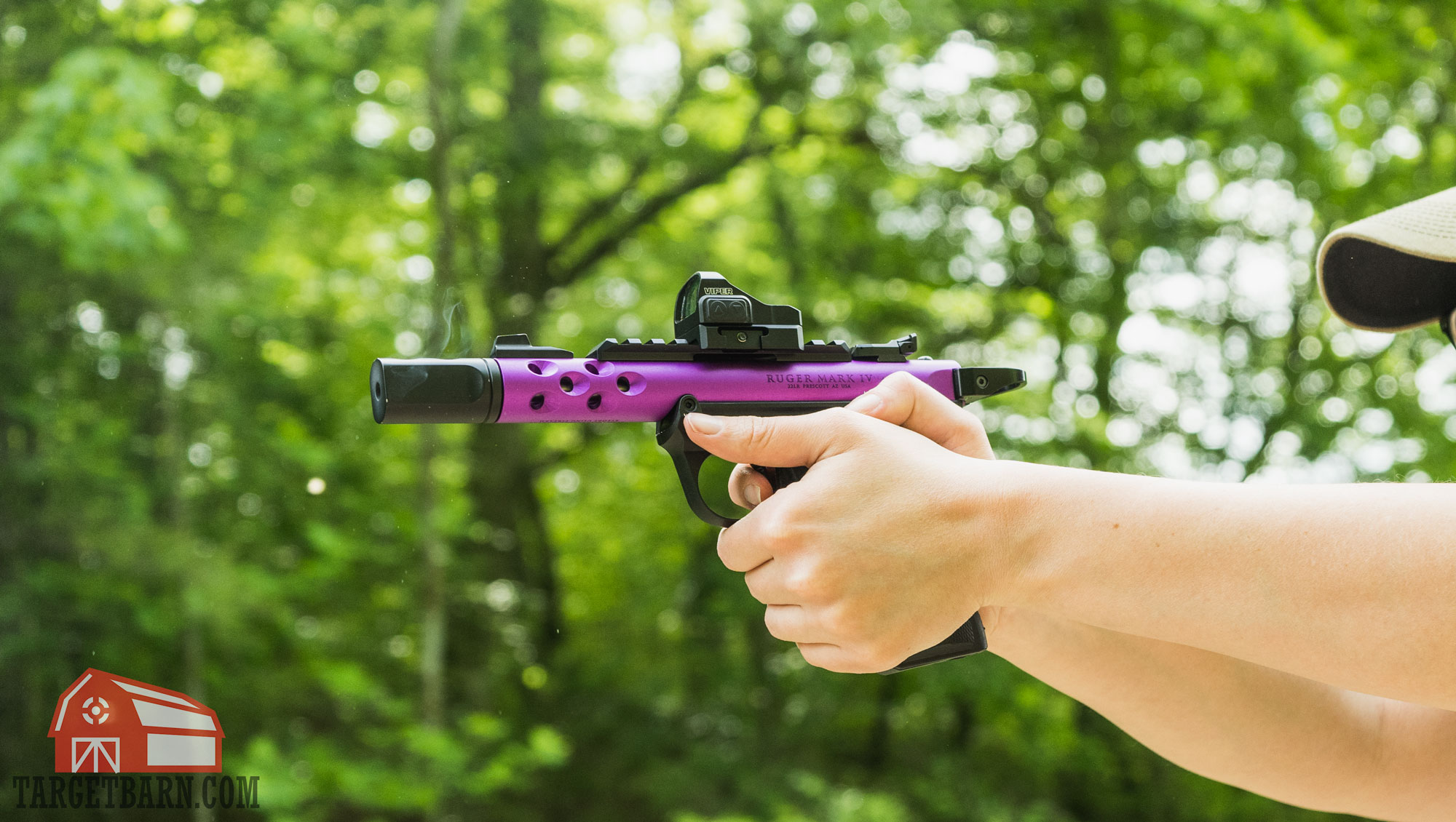 gases venting out of a pistol compensator