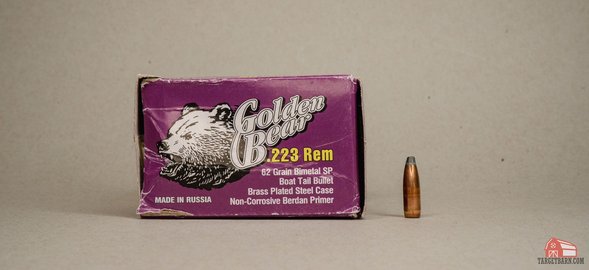 a box of golden bear 223 rem boat tail ammo and one bullet pulled from the casing