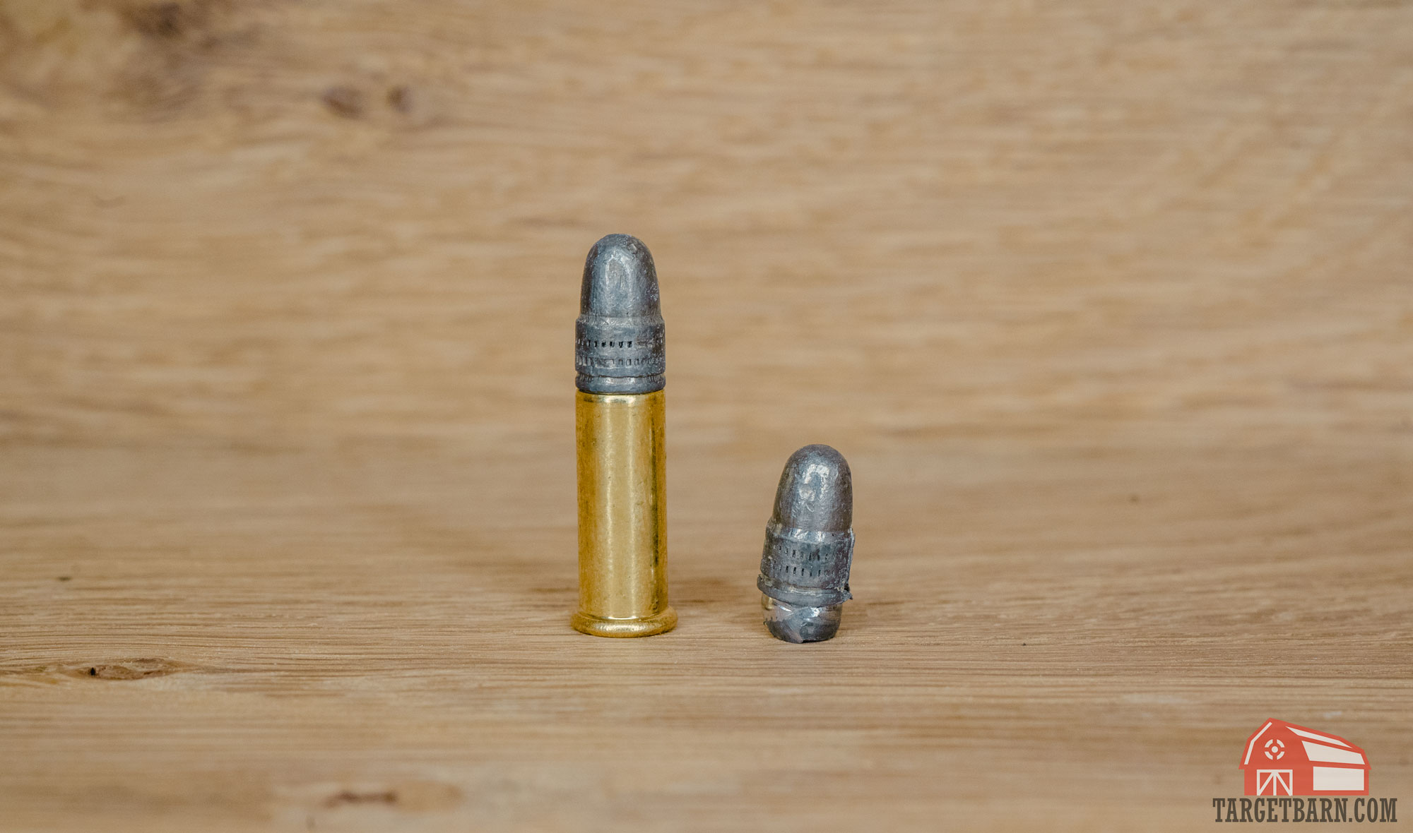 a 22lr cartridge next to a 22lr heeled bullet