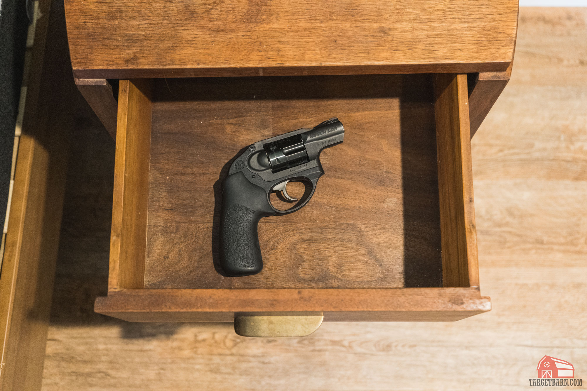 an unsecure gun stashed away in a nightstand