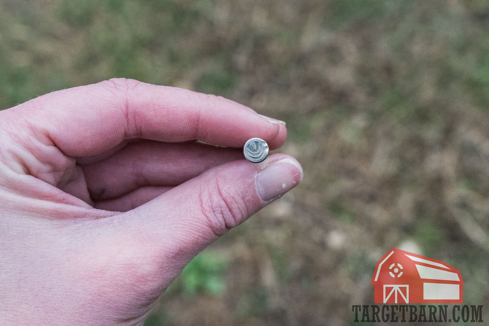 light primer strike holding a .22 wmr round showing two light primer strikes