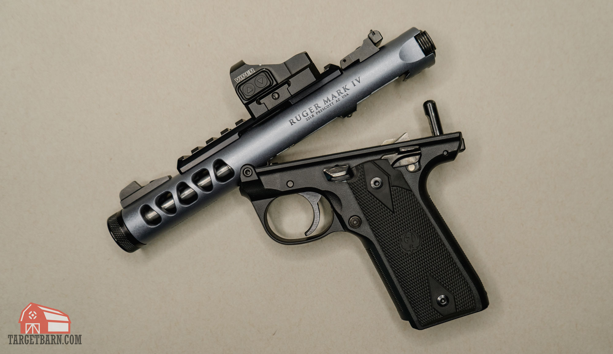 showing how the ruger mark iv 22/45 lite hinges open with the one button takedown