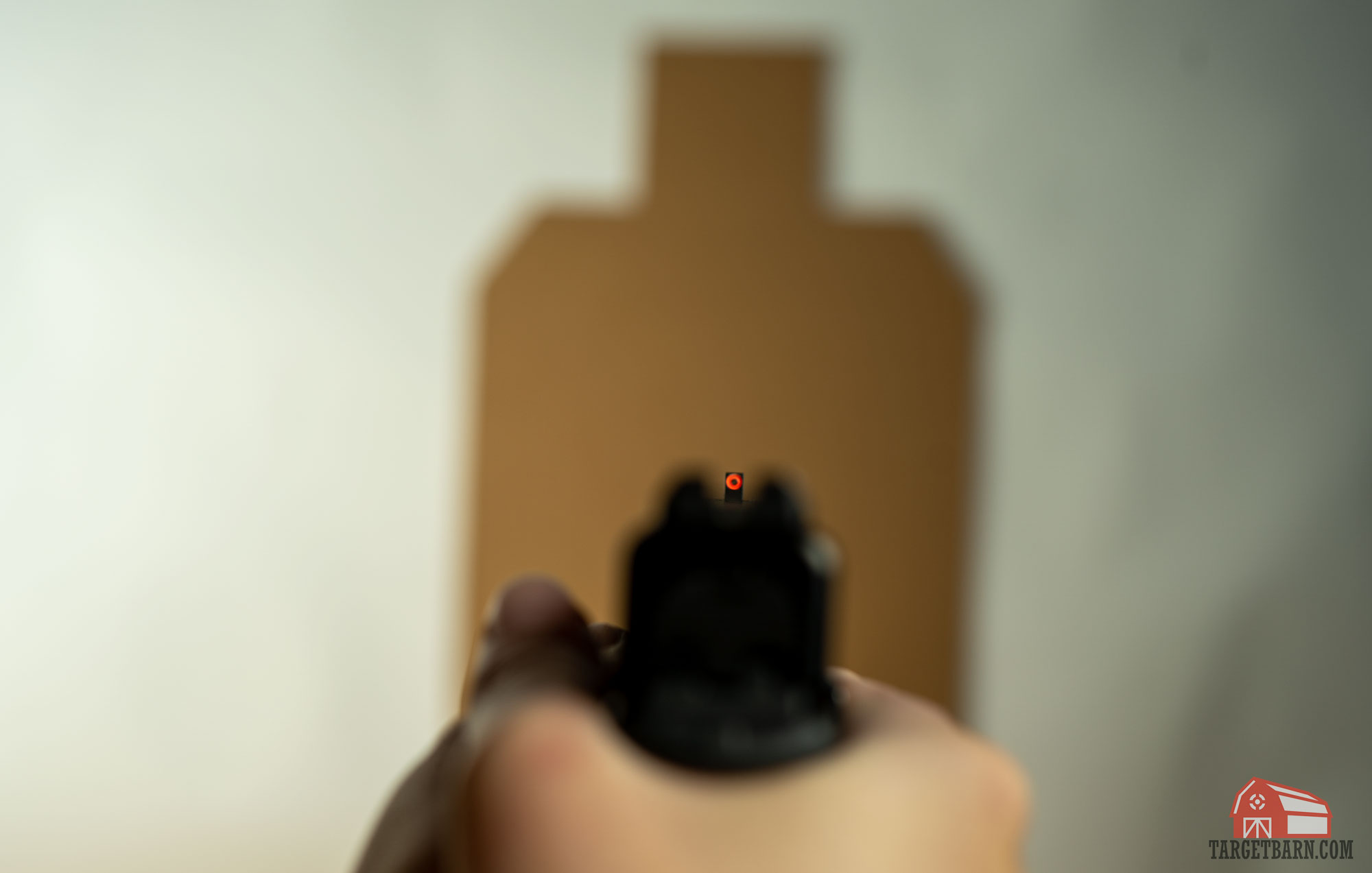 the optimal sight picture has a clear focus on the front sight with a blurry target