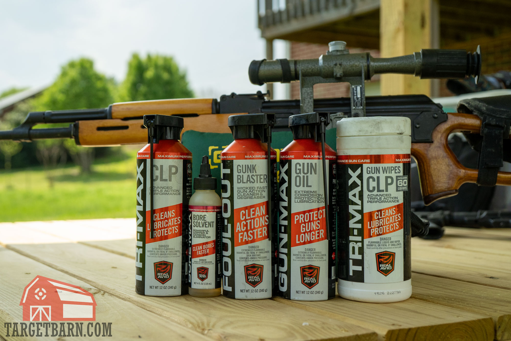 real avid gun cleaning products in front of a rifle