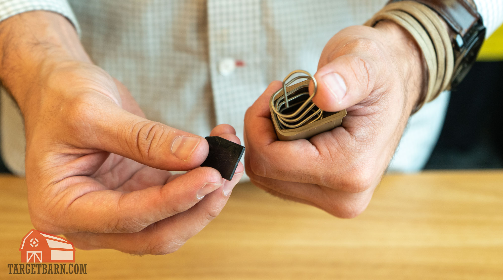 removing the lock plate and spring from the magazine tube