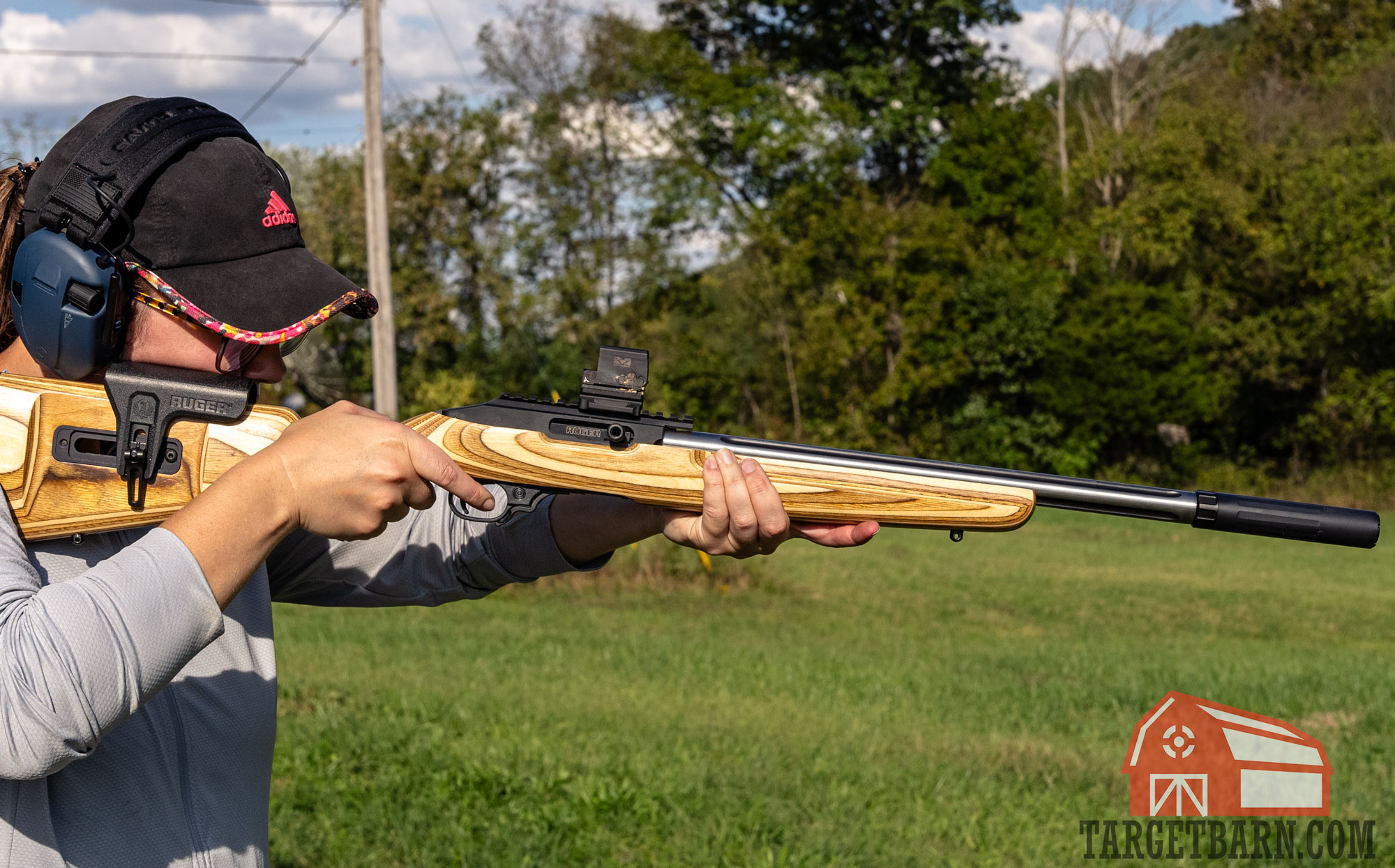 shooting ruger 10/22 a woman shooting a suppressed ruger 10/22 at the range for the cci blazer .22lr review