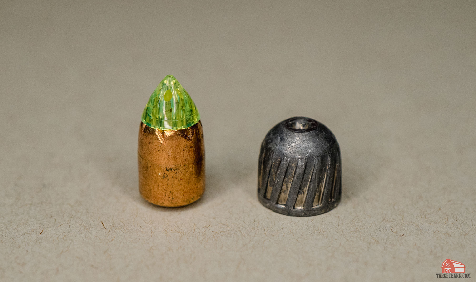 a sabot slug vs. rifled slug pulled from the shot shells to show the slugs