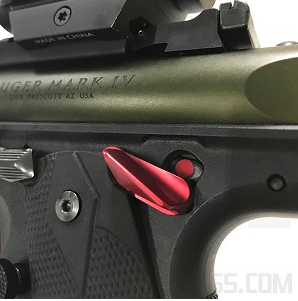 a red cornerstone safety thumb ledge from tandemkross mounted on a ruger mark iv 22/45 lite