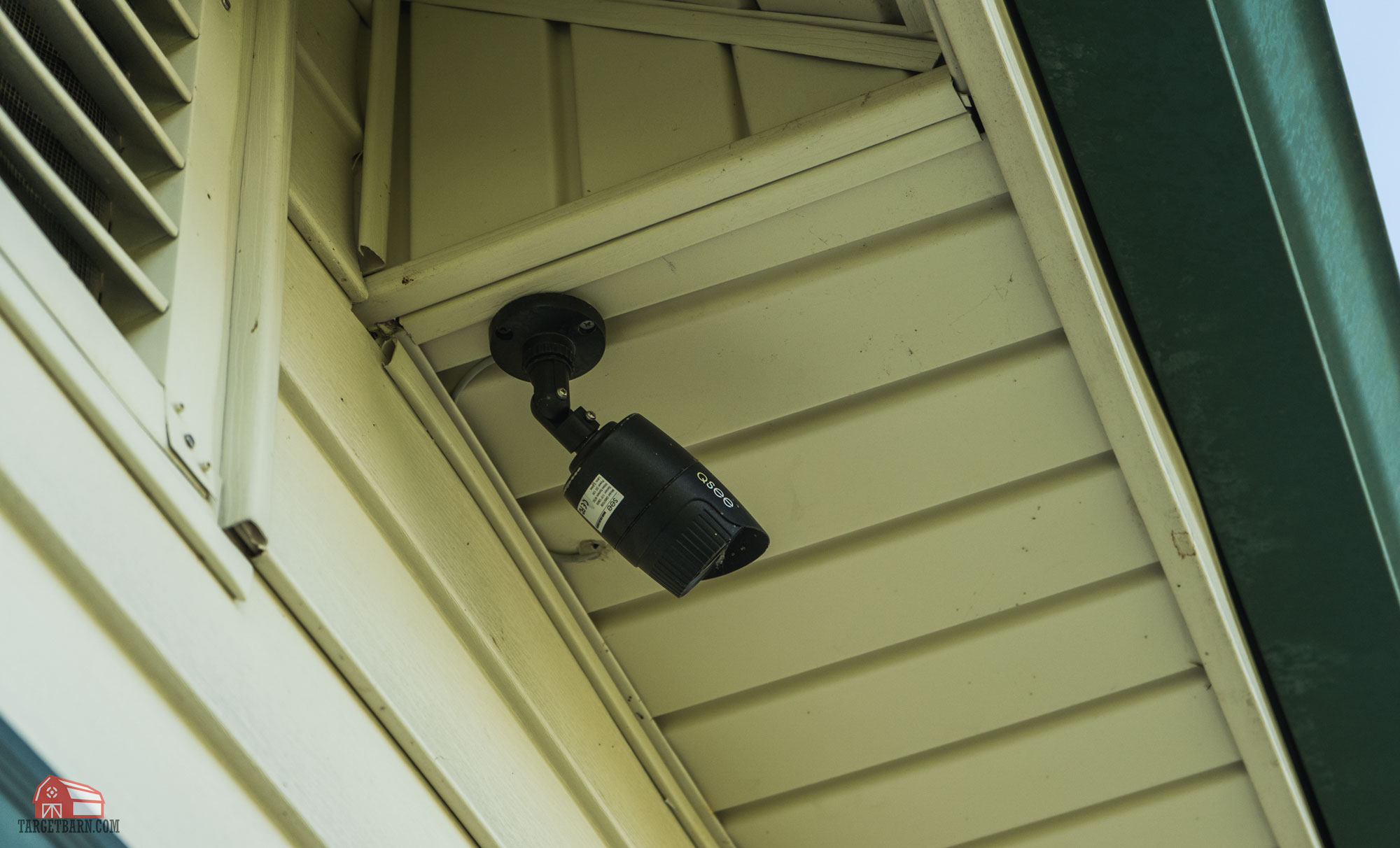 a security camera mounted onto a home