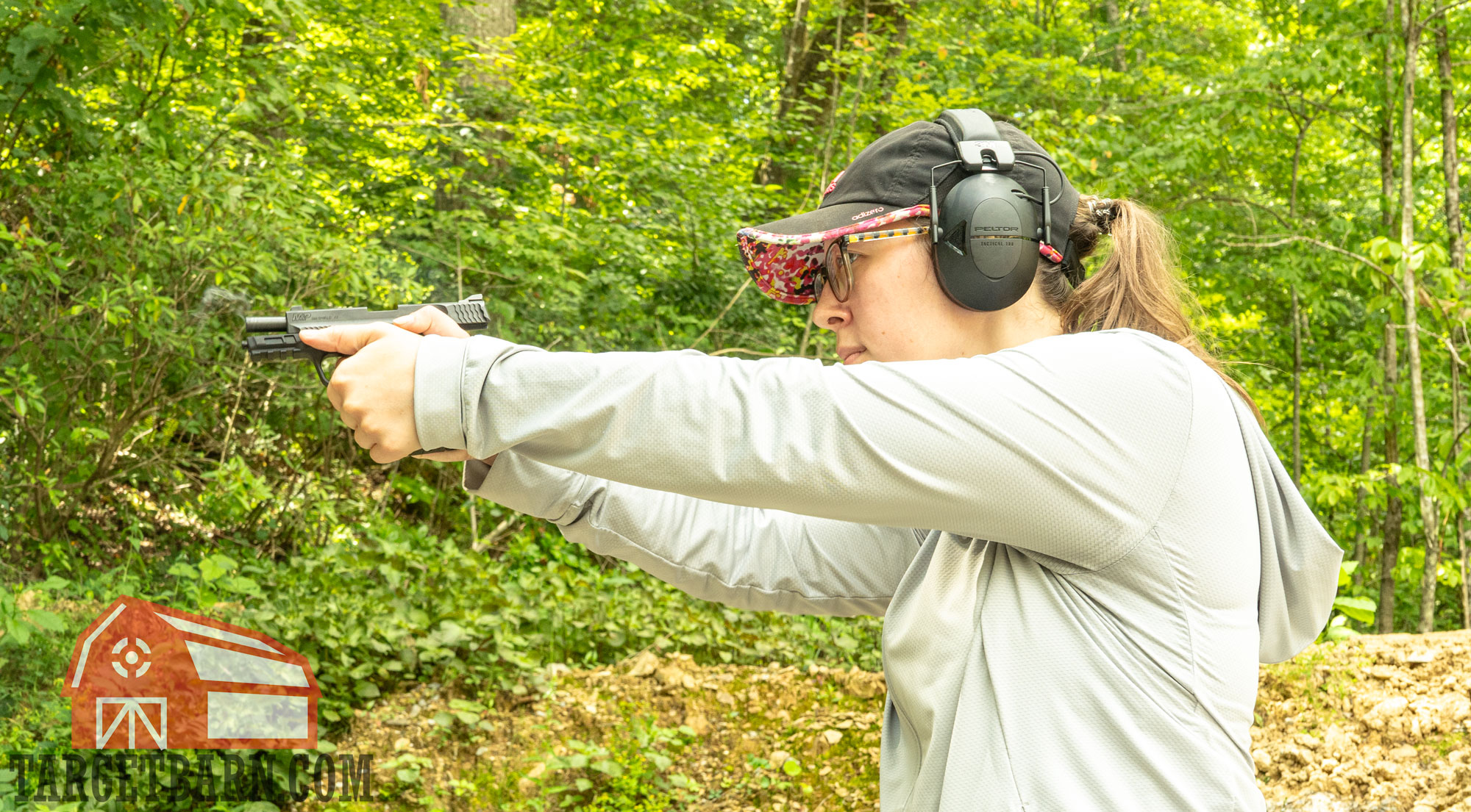 shooting 9mm ammo a woman shooting a 9mm pistol
