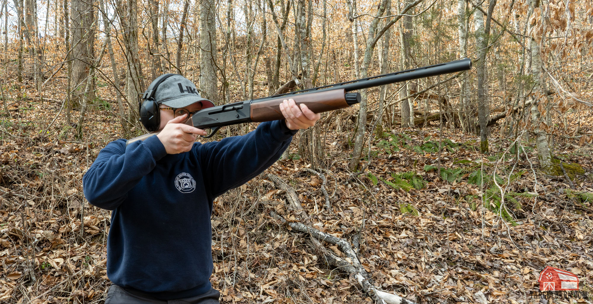 mckenzie shooting a semi-auto 20 gauge shotgun at the range