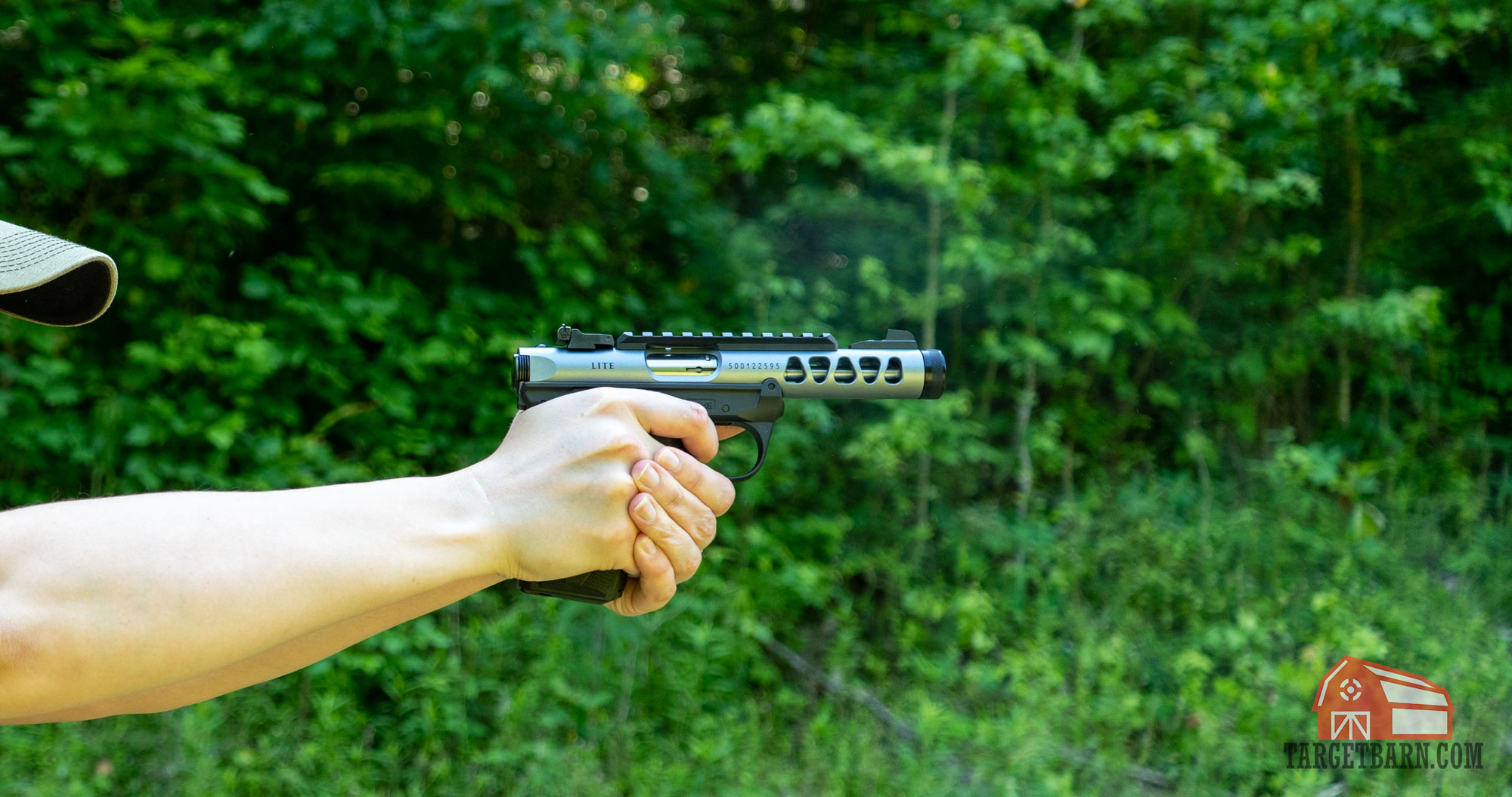 the author shooting a ruger mark iv 22/45 lite at the range