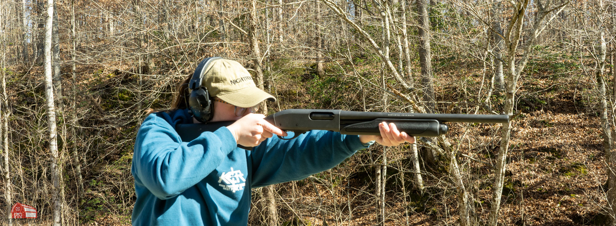mckenzie shooting a pump action 12ga shotgun at the range