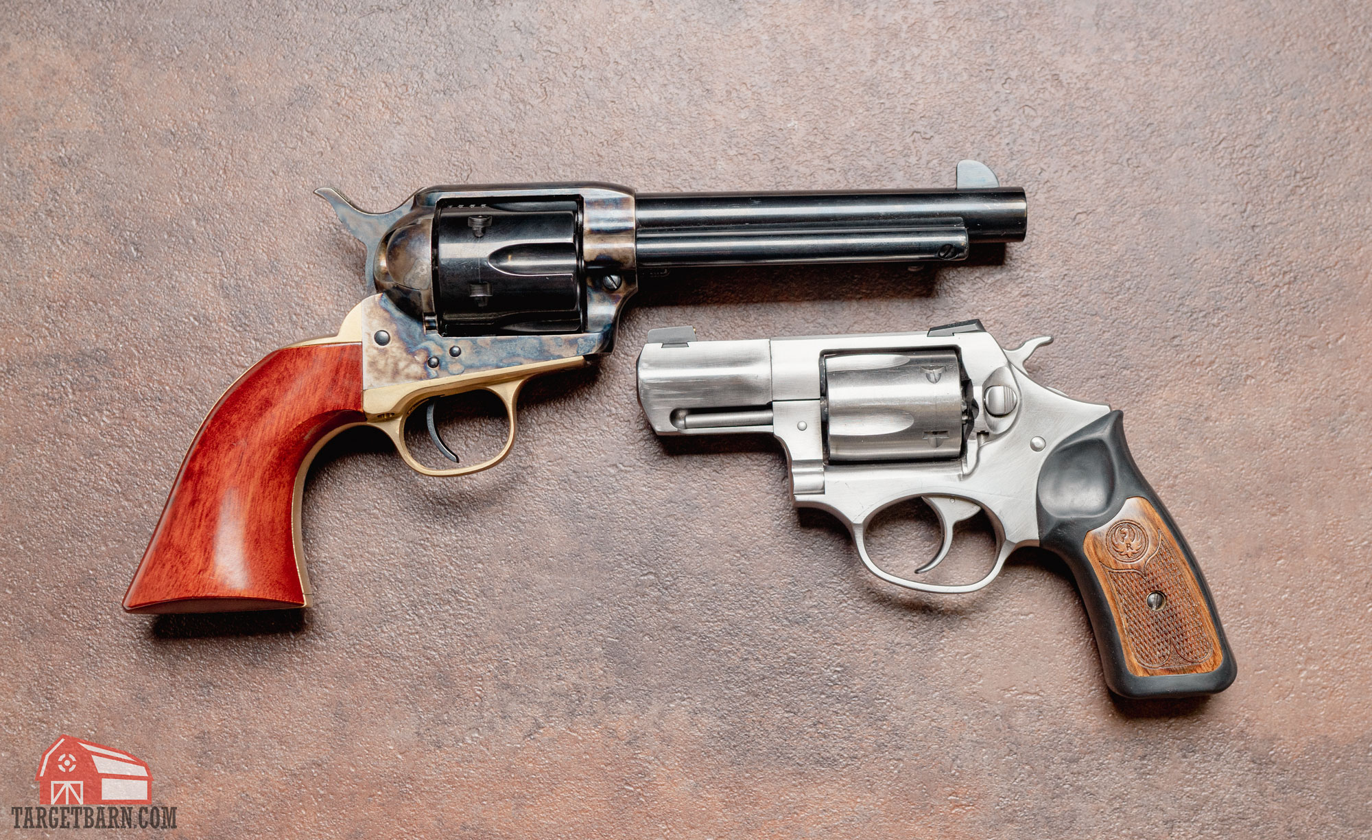 a single action revolver next to a double action revolver