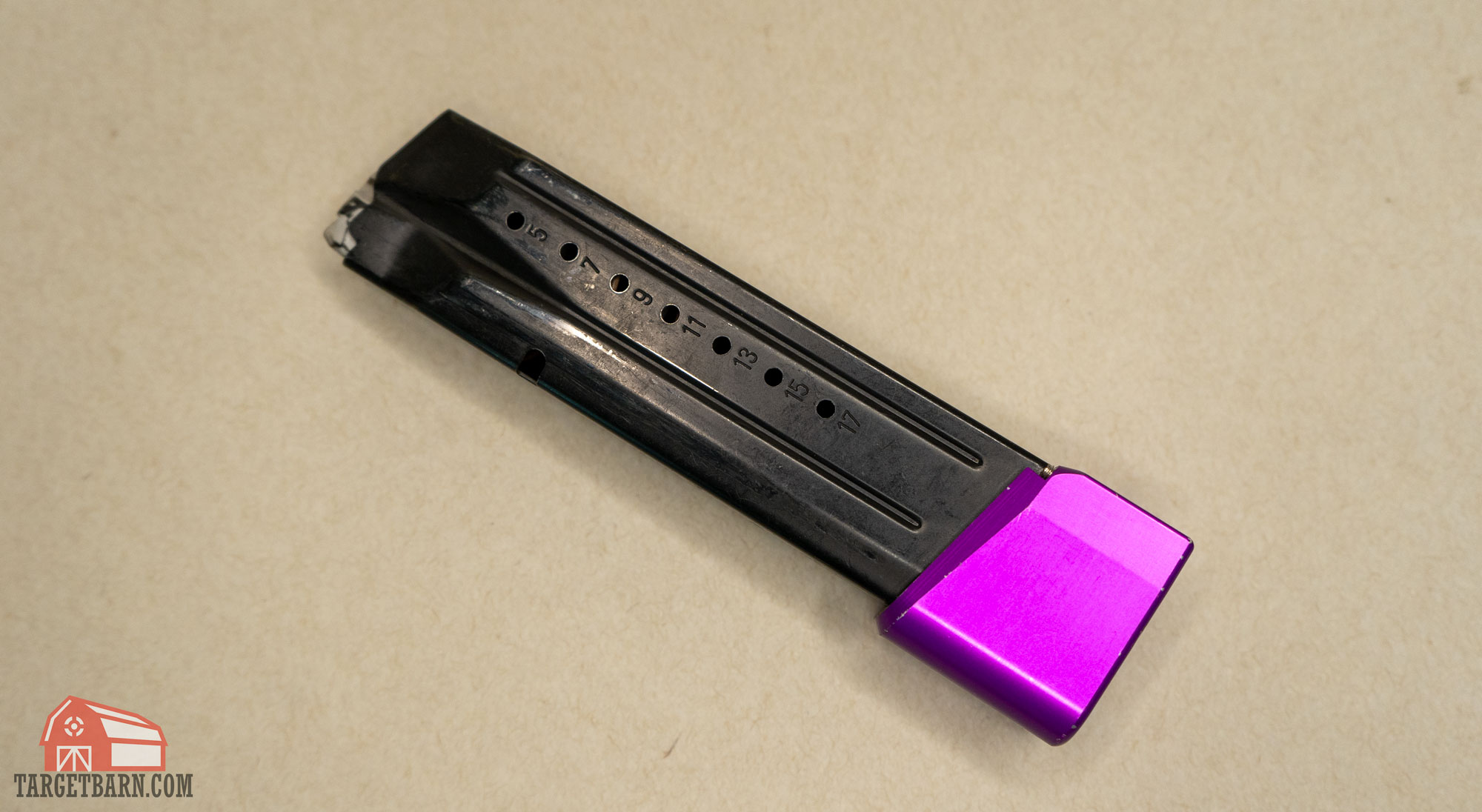 a purple magazine basepad extender from springer precision